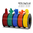 Five spools of PETG filament in red, green, blue, orange, and yellow with 3D printed models on a white background.