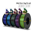 Five spools of Silk PLA filament with colorful dragons on a white background