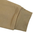 Close-up of a beige fabric with a textured pattern on a white background