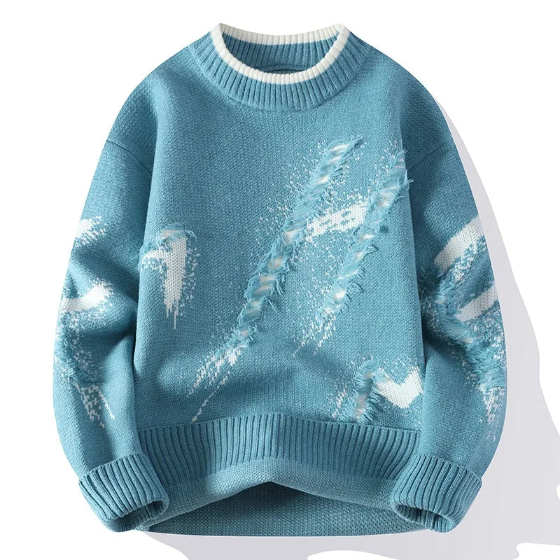 Blue sweater with white distressed patterns on a white background