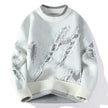 Light blue sweater with snowflake pattern on a white background