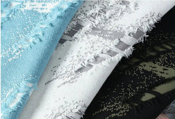Close-up of various fabric textures with a dark blue background