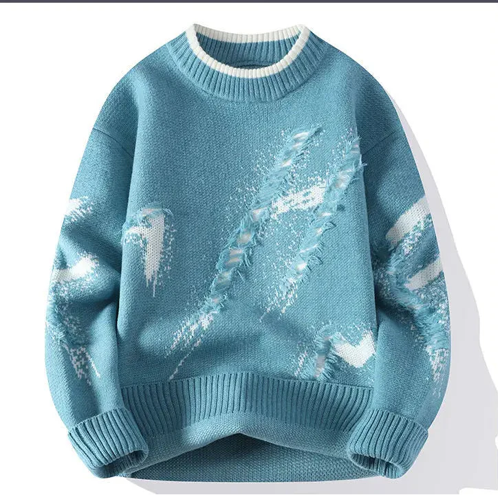 Blue sweater with white patterns on a white background