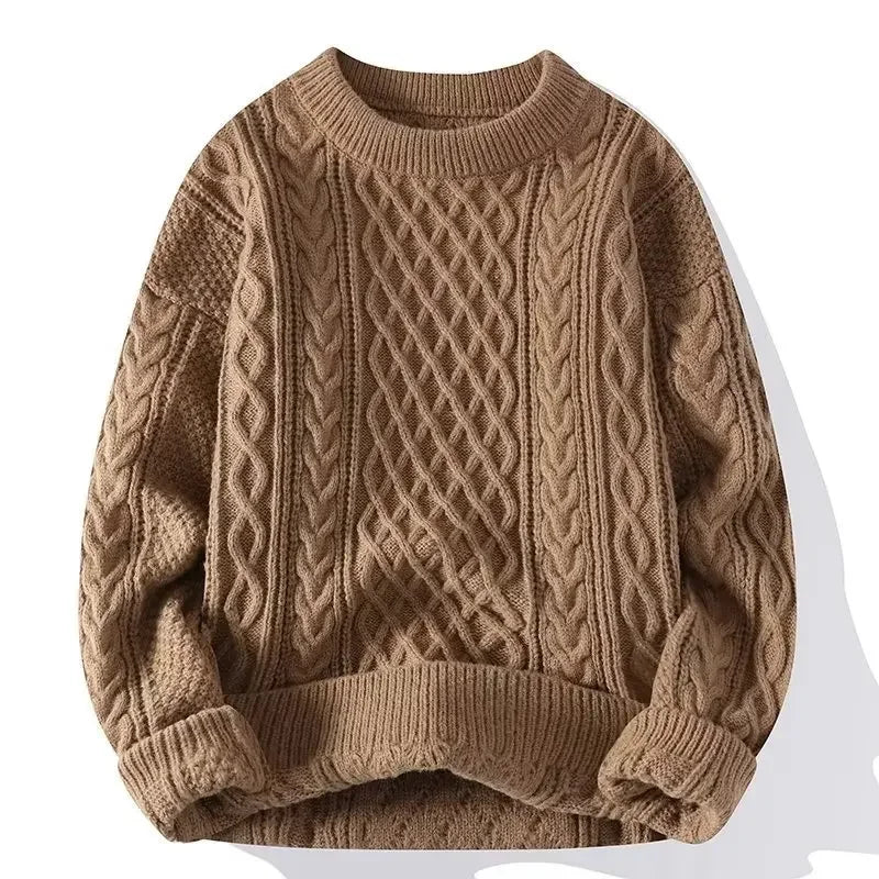 Brown cable knit sweater on a white background