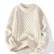 White cable knit sweater on a white background