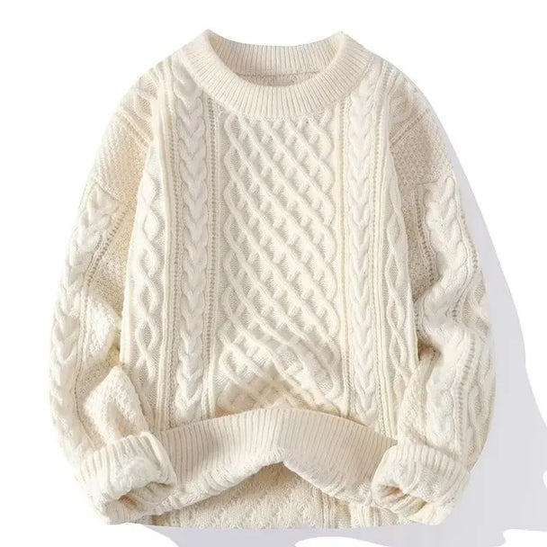 White cable knit sweater on a white background
