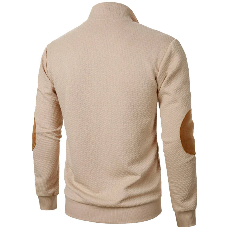 Beige jacket with brown elbow patches on a white background