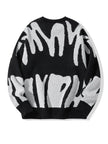 Black sweater with white abstract pattern on a white background