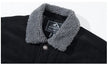 Black jacket with gray sherpa collar and Magcomsen logo on a white background