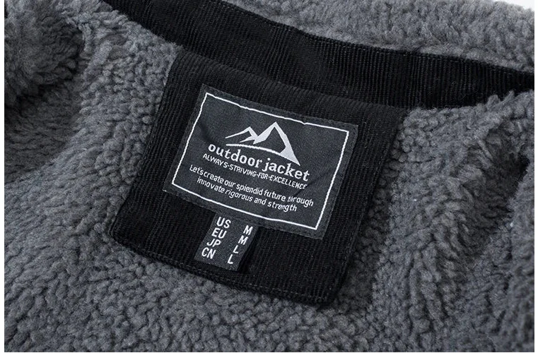 Gray fleece jacket with a brand label on a white background