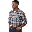 Man wearing a plaid shirt with Magcomsen logo in the corner