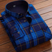 Blue plaid shirt on a wooden surface