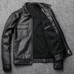 Black leather jacket on a textured gray background