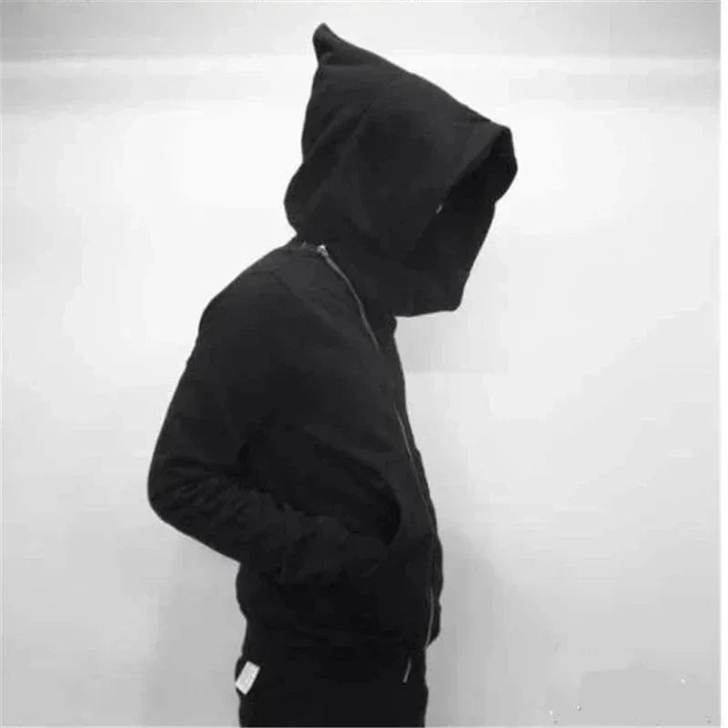 Person wearing a black hoodie against a white background