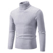 Light gray turtleneck sweater on a white background