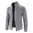 Gray zip-up sweater with plaid lining on a white background