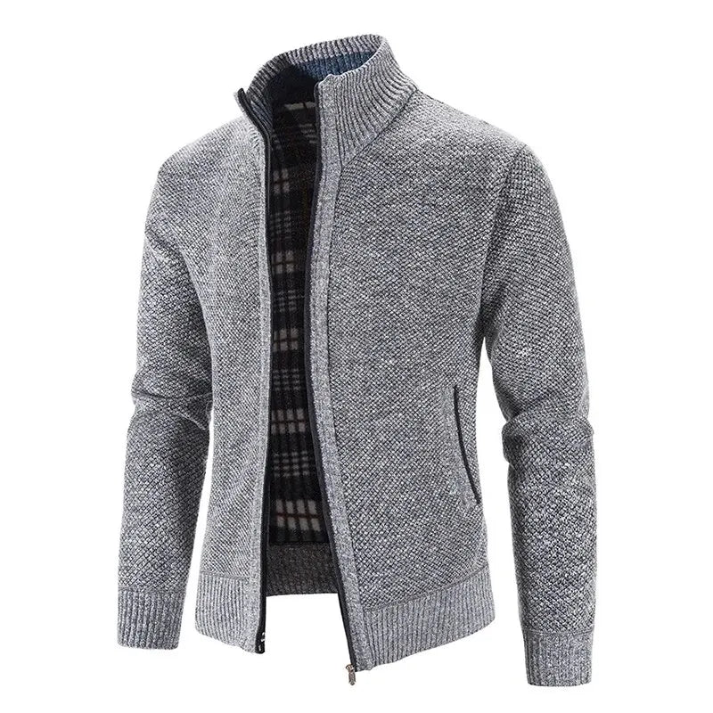 Gray zip-up sweater with plaid lining on a white background