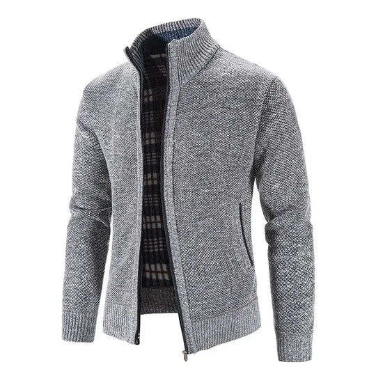 Gray zip-up sweater with plaid lining on a white background