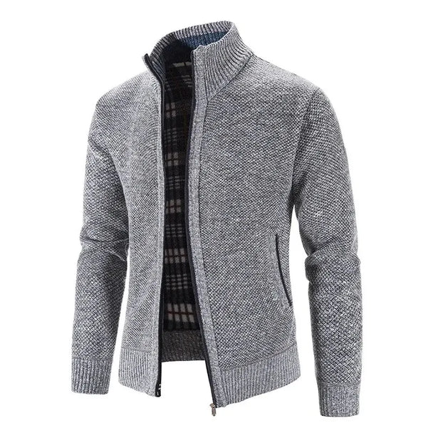 Gray zip-up sweater with plaid lining on a white background