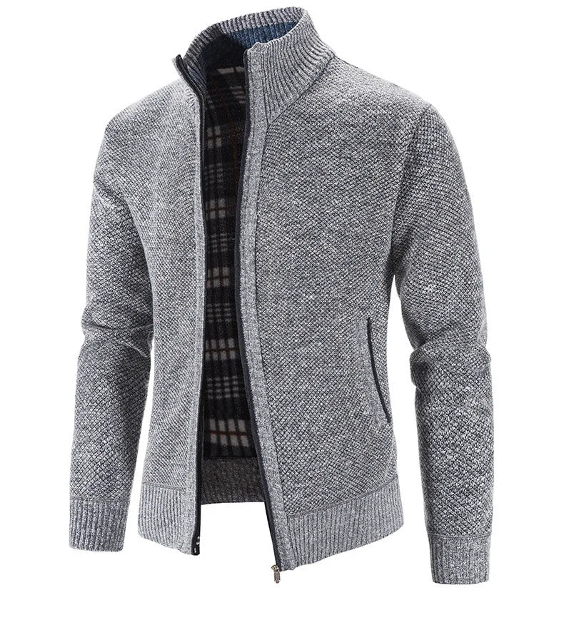 Gray knitted cardigan with plaid lining on a white background