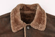 Brown jacket with a fluffy collar on a beige background