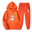 Orange hoodie and pants set with a teddy bear design on a white background