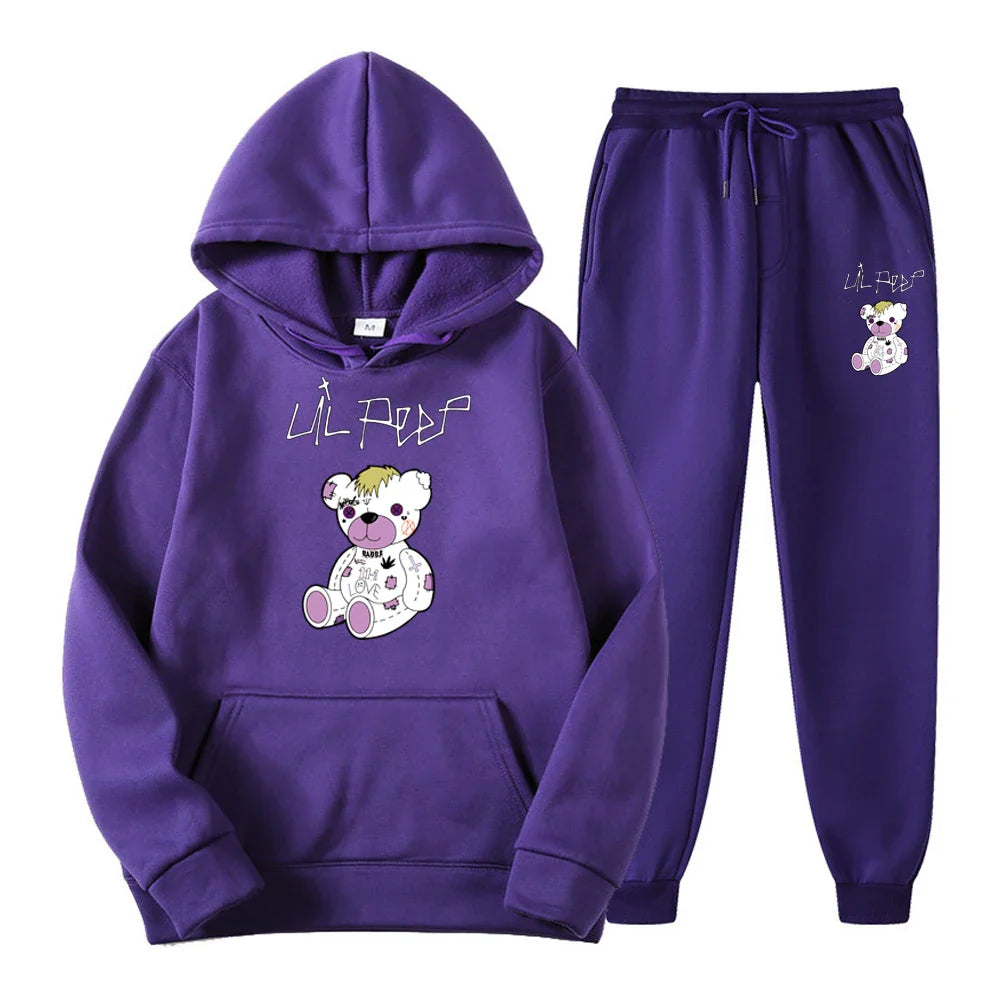 Purple hoodie and pants set with a teddy bear design on a white background