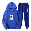 Blue hoodie and pants set with bear design on a white background
