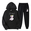 Black hoodie and pants set with a teddy bear design and text on a white background