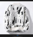 White sweater with black abstract pattern on a white background