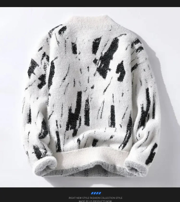 White sweater with black abstract pattern on a white background
