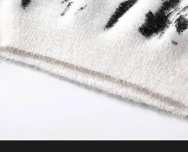 Close-up of a white fabric with black floral patterns on a white background