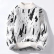 White sweater with black abstract pattern on a white background