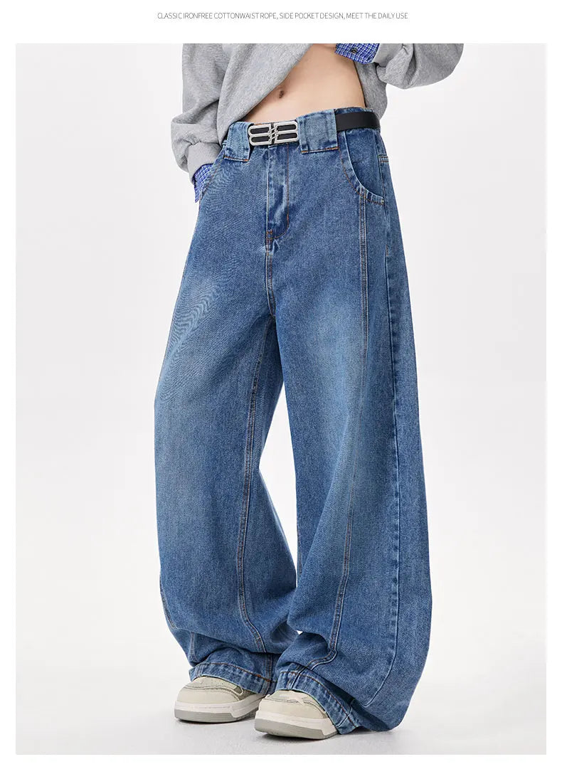 Person wearing blue jeans on a white background