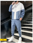 Person wearing a blue and white tracksuit on a staircase