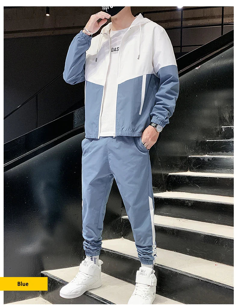 Person wearing a blue and white tracksuit on a staircase