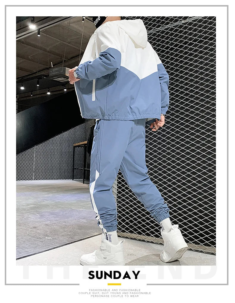 Person wearing a blue and white tracksuit with 'SUNDAY' branding in an indoor setting.