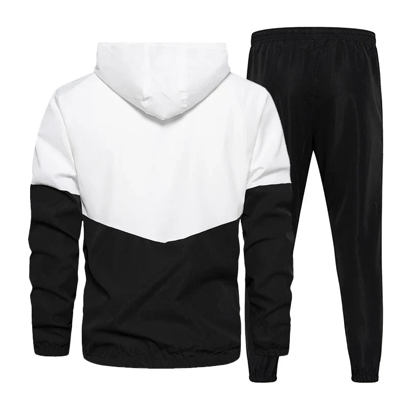 Black and white tracksuit with hoodie and pants on a white background