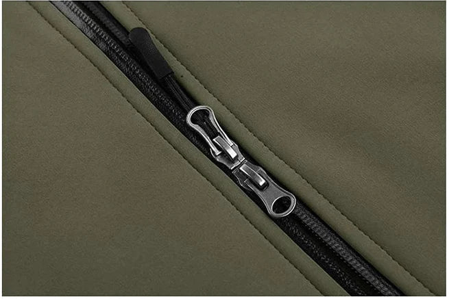 Close-up of a zipper on a green fabric background