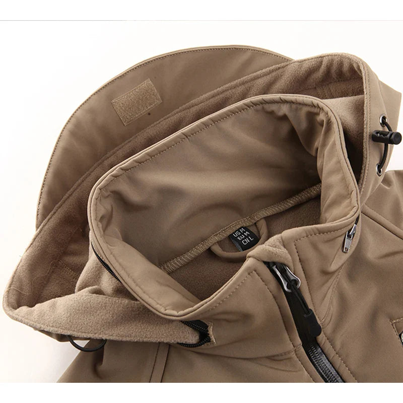 Close-up of a beige jacket with a hood on a white background