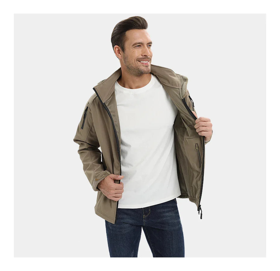 Man wearing a beige jacket over a white shirt and blue jeans on a white background