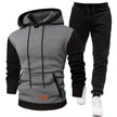 Gray and black hoodie with matching pants on a white background