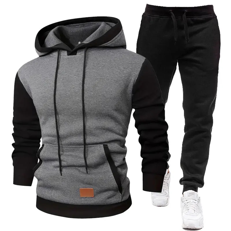 Gray and black hoodie with matching pants on a white background
