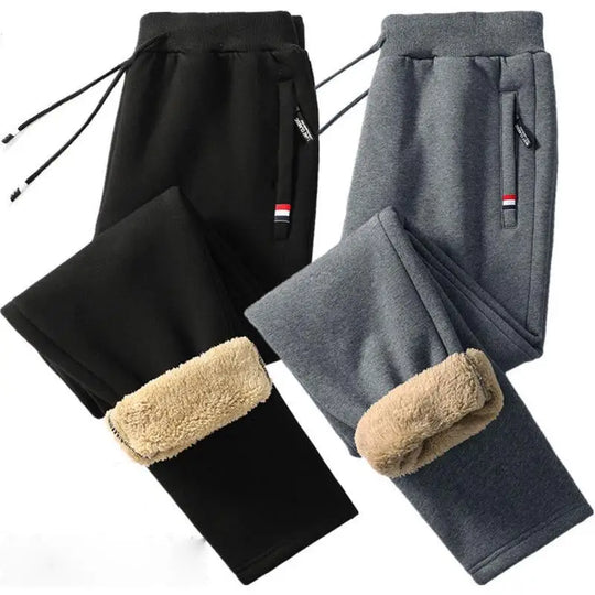 Black and gray fleece-lined pants with beige cuffs on a white background