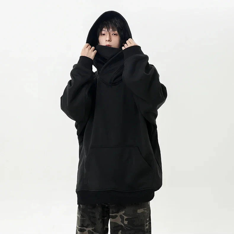 Person wearing a black hoodie on a white background