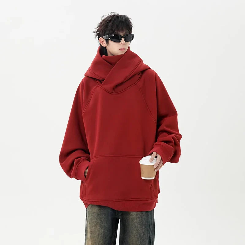 Person wearing a red hoodie holding a coffee cup on a white background