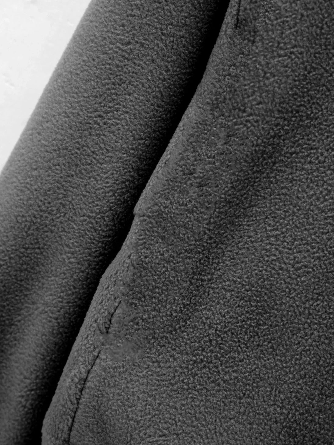 Close-up of a textured gray fabric surface