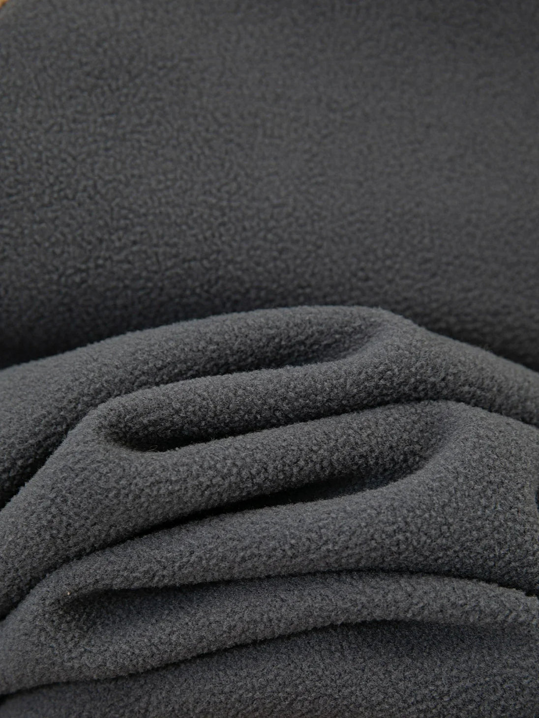 Close-up of dark gray textured fabric