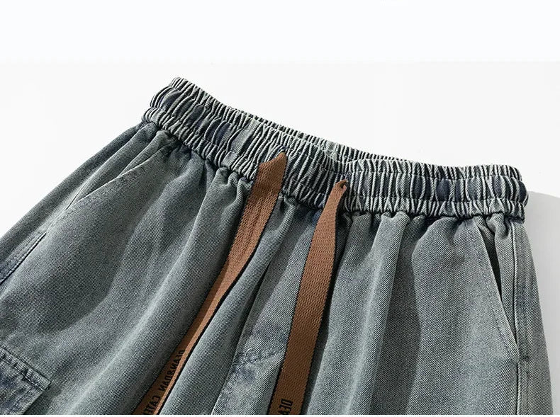 Gray denim shorts with brown straps on a white background, featuring the brand 'DEATLS DISPLAY'.