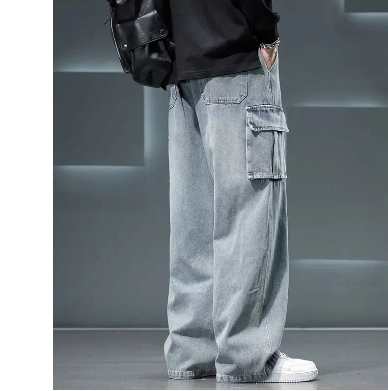 Person wearing light gray cargo pants with a blurred background